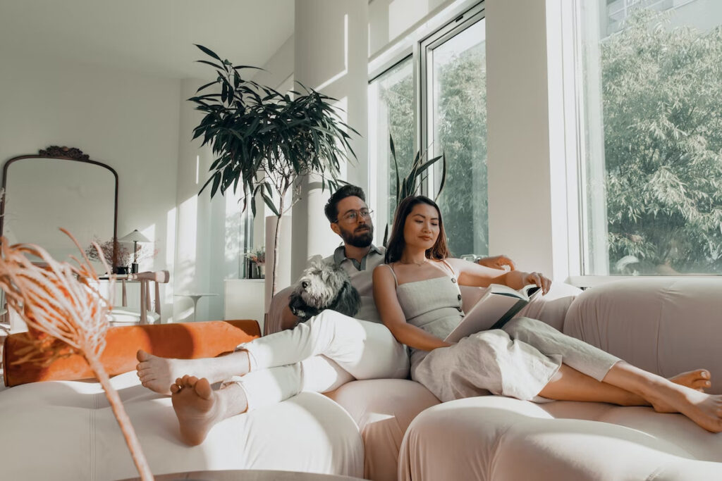 a woman and a man spending time together in  their living room