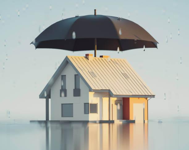 a house 3D illustration with a black umbrella on top shielding it from rain