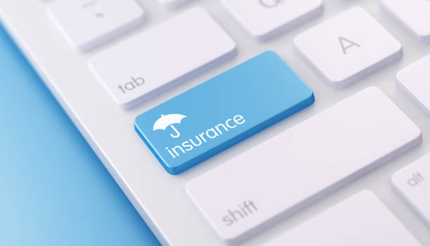 an umbrella and the word insurance on the caps lock key on the keyboard