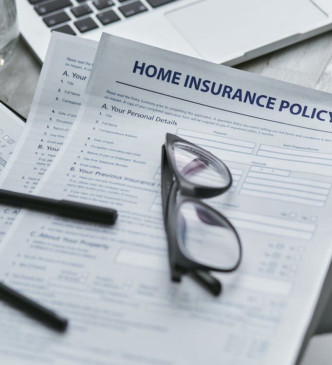 image of a home insurance policy with an eye glass on top